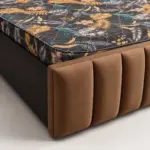 Rio brown upholstered storage bed with vertically panelled headboard and matching padded footboard.